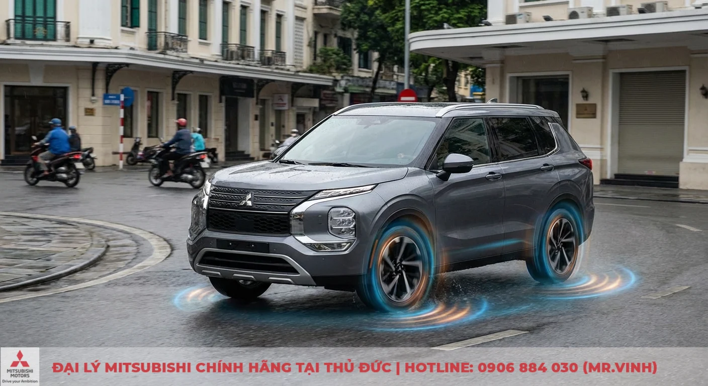 An toàn Destinator 2026: Công nghệ Mitsubishi bảo vệ bạn trên mọi hành trình 2 Xe SUV Mitsubishi màu xám cua trên đường ướt, thể hiện công nghệ cân bằng và kiểm soát chủ động qua hiệu ứng bánh xe